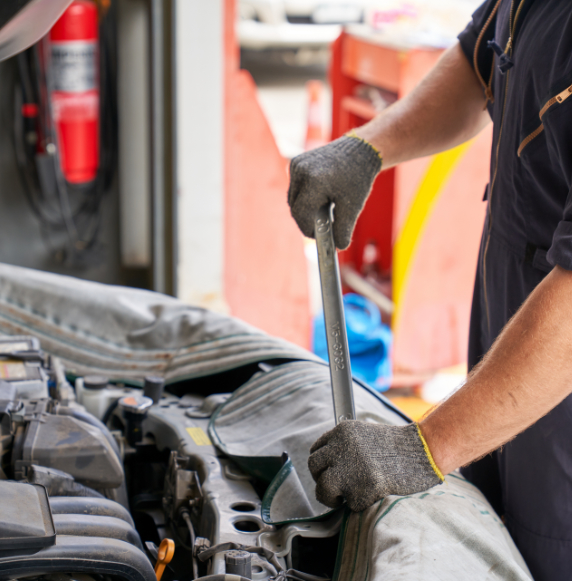 Mechanic man try to repair engine of car